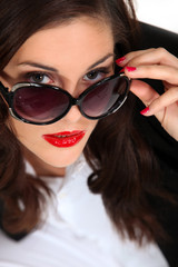 brunette with captivating gaze and red lipstick