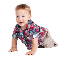 Smiling baby crawling on the floor