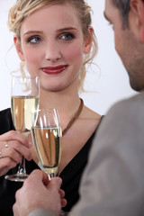 Elegant couple drinking champagne