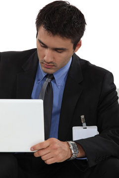 Male reposter with laptop waiting for interview