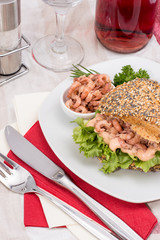 Roll with Shrimps on a red striped tablecloth