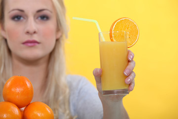 Woman with glass orange juice