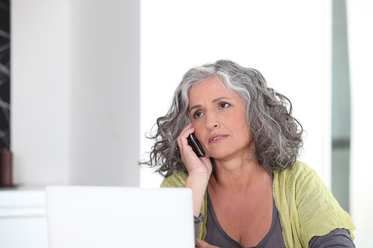 Grey-haired lady embracing the digital age
