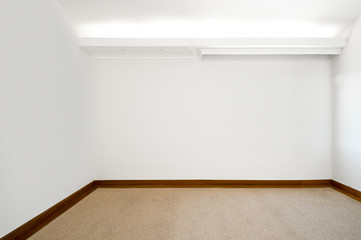 Empty white room with carpeted floor