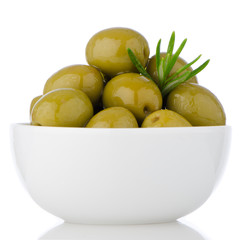 Green olives in a white ceramic bowl