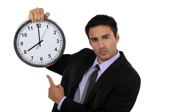 Businessman with a clock