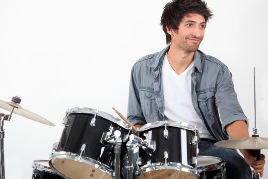 Young playing drums