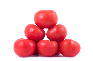 Ripe red tomatoes isolated on a white background