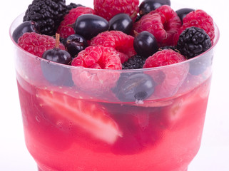 Tasty colorful jelly with mix berries on a white background