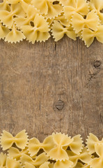 pasta and spaghetti on wood background