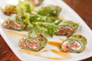 tasty appetizer with salmon and cheese