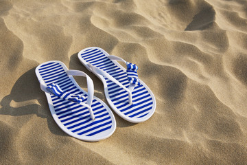 Flip-flops on sand beach