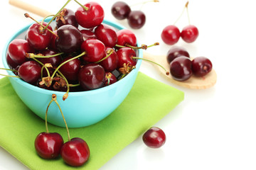 Ripe cherry berries in bowl isolated on white