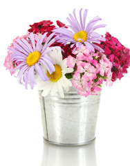 beautiful bouquet of bright wildflowers in bucket, isolated