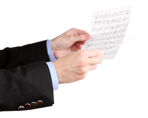Fototapeta premium Music conductor hands with baton and notes isolated on white