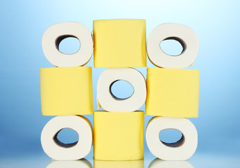 rolls of toilet paper on blue background