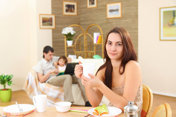 The young woman at breakfast