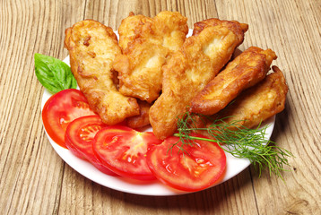 Fish fried in dough on a plate