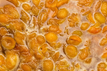 apricot jam in the background