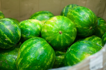 Bunch of fresh watermelons in supermarket