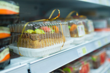 Biscuit caces on shelves in supermarket