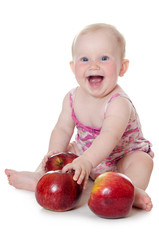 Fototapeta premium The little baby with red apples