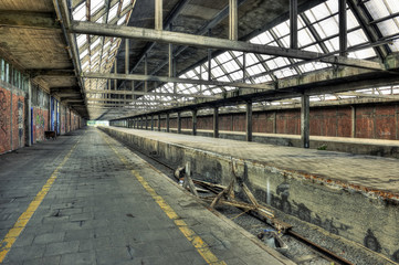 Naklejka premium Abandoned platform at a derelict railway station