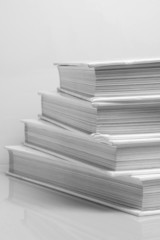 Stack of books on white background
