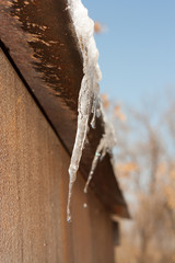 ice on a rusty metal roof