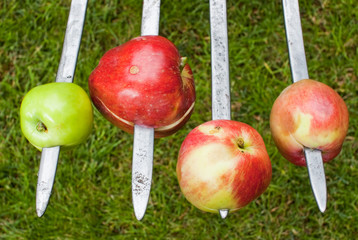 Fresh apples impaled on the forks