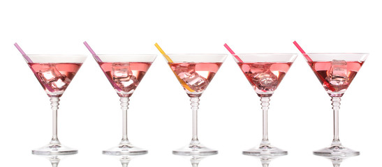 Red cocktail in martini glasses isolated on white