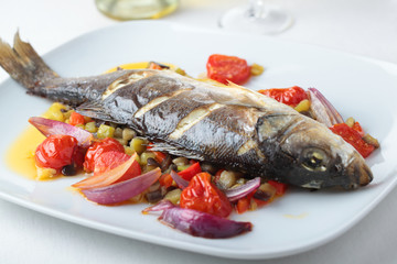 Baked sea bass with vegetables