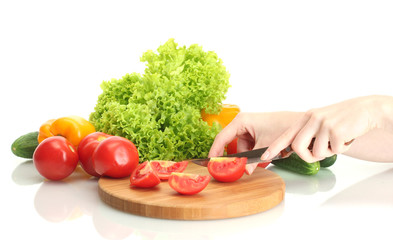 woman hands cutting vegetables on kitchen blackboard