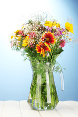 beautiful bouquet of bright  wildflowers in glass vase,