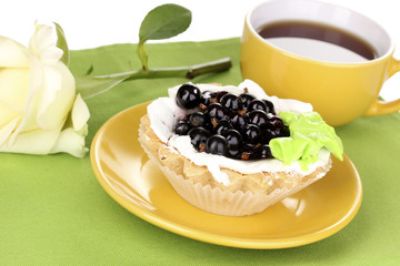 sweet cake with cup of tea close-up