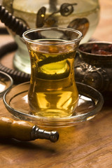 Cup of turkish tea and hookah served in traditional style