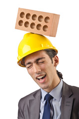 Businessman with bricks on white