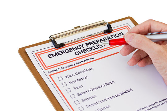 Hand completing Emergency Preparation List