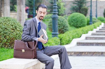 Fototapeta premium Young businessman on the street