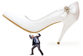 Woman domination concept with shoes and man