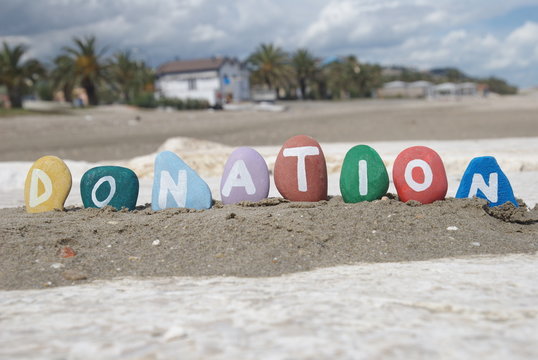 donation concept on colourful pebbles