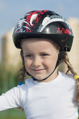 positive portrait of young little skater girl outside