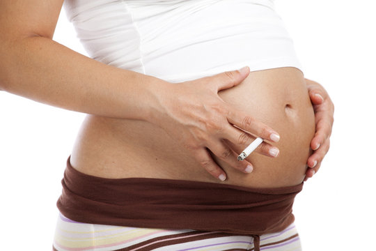 A pregnant woman with cigarette