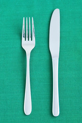 Silverware on the green napkin