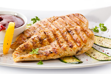 Grilled chicken breasts and vegetables