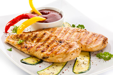Grilled chicken breasts and vegetables