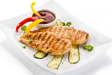 Grilled chicken breasts and vegetables