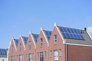 Modern Dutch houses with solar panels on roof