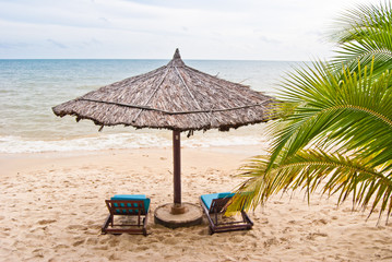 Two beach beds under sunshade on the Sokha beach, Cambodia
