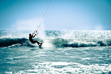 Kite surfing in waves. - obrazy, fototapety, plakaty